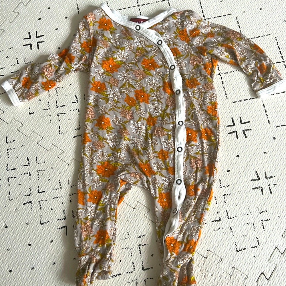 Milkbarn floral button footed onsie. Size 0-3months